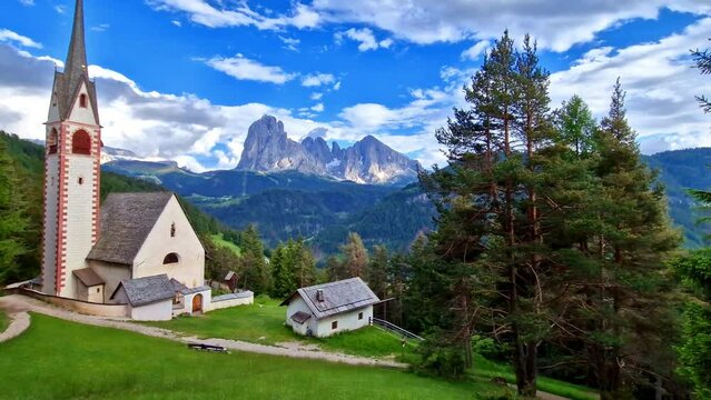 Amazing Alpine scenery. Beautiful Dolomites mountains. view of San Giacomo church near Ortisei village. Val Gardena, South Tyrol, Italy 