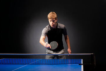 Portrait of young man playing tennis