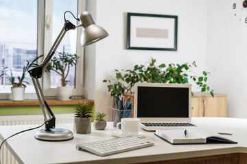 Office workspace with desktop computer, office supplies