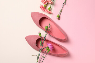 Women's pink shoes with flowers on a white background