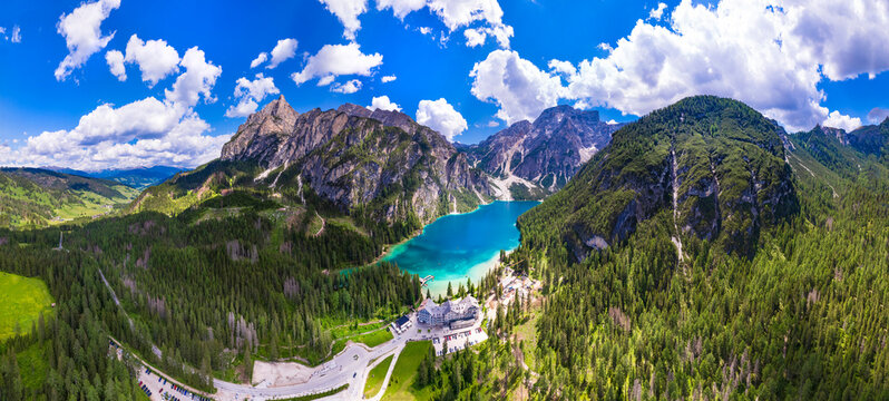 south Tyrol, Italy .  One of the most beautiful mountain Alpine lakes - magic Lago di Braies, sorrounded by Dolomites mountains. aerial drone panoramic view.