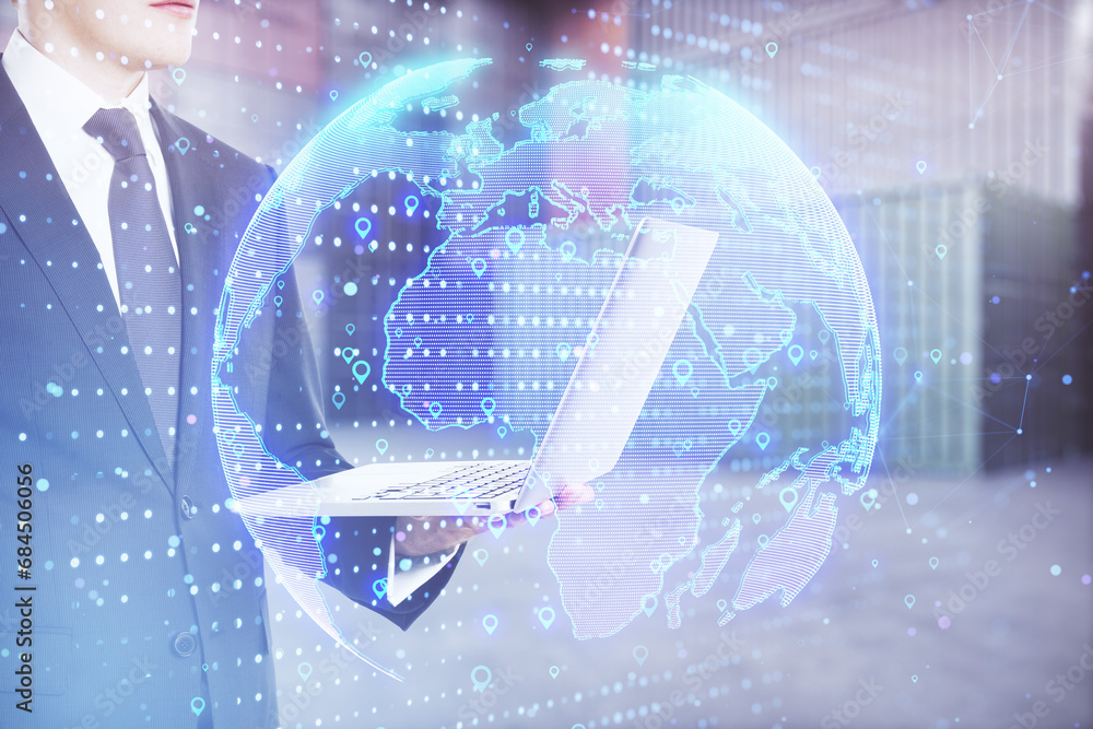 Poster young european businessman using laptop computer with glowing globe hologram with location pins on b