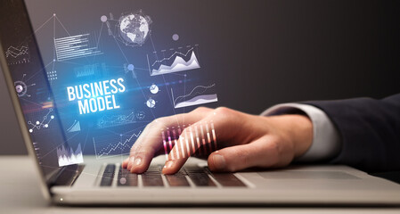 Businessman working on laptop, business concept