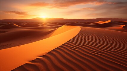 A desert landscape with the sun setting behind sand dunes, casting long shadows