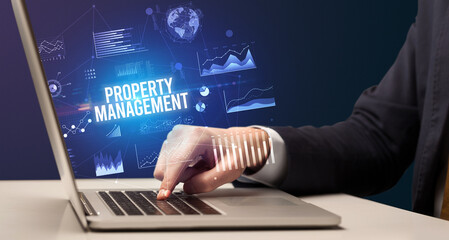 Businessman working on laptop, business concept