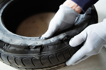 A low-quality car tire that has not passed the crash test. Examination of automotive rubber and a...