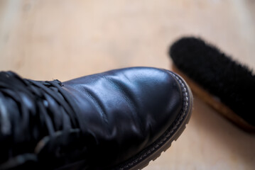 Black boot after polishing with shoe polish