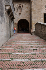 Entrance to the Courtyard of Palazzo Comunale, also known as the Palazzo del Popolo in San Gimignano. Tuscany, Italy