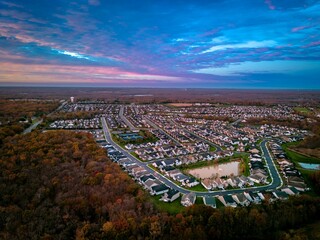 Scenic aerial view of Monroe, New Jersey cityscape at sunrise with a cloudy sky
