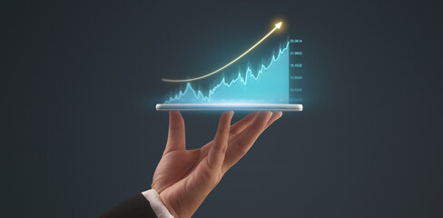 Businessman plan graph growth and increase of chart positive indicators,tablet in hand