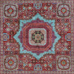 Pattern of traditional Turkish carpet. Multicolor fragment, red and cyan ornament. Kushadasi, Turkey (Turkiye)