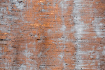 The background of the grunge wall, stucco rough surface. Bronze and gray. Background or texture for design