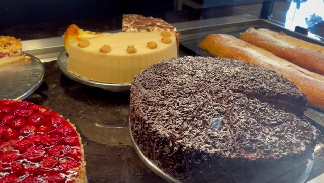 Strawberry cheesecake, chocolate cake and more desserts on display at traditional German bakery