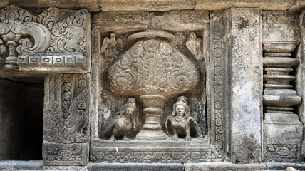 Stone relief on the wall of Prambanan Temple. A Hindu temple located in Yogyakarta, Indonesia