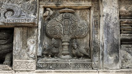 Stone relief on the wall of Prambanan Temple. A Hindu temple located in Yogyakarta, Indonesia