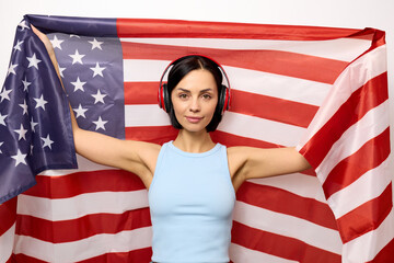 Young woman received American citizenship and holding a flag