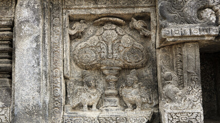 Stone relief on the wall of Prambanan Temple. A Hindu temple located in Yogyakarta, Indonesia