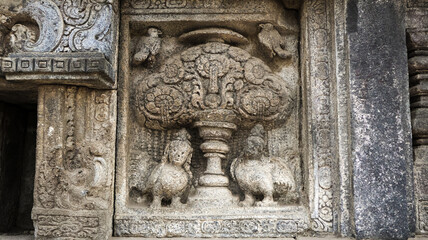 Stone relief on the wall of Prambanan Temple. A Hindu temple located in Yogyakarta, Indonesia