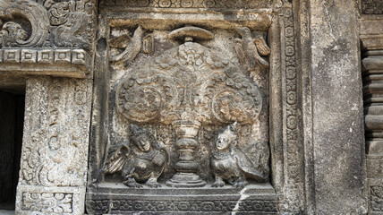 Stone relief on the wall of Prambanan Temple. A Hindu temple located in Yogyakarta, Indonesia