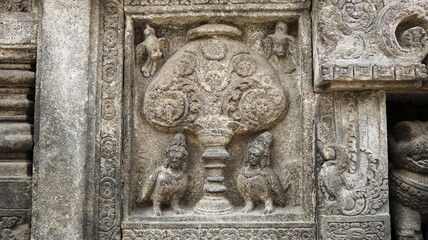 Stone relief on the wall of Prambanan Temple. A Hindu temple located in Yogyakarta, Indonesia