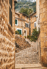 A charming old staircase in the cozy street of a small village Fornalutx in Mallorca