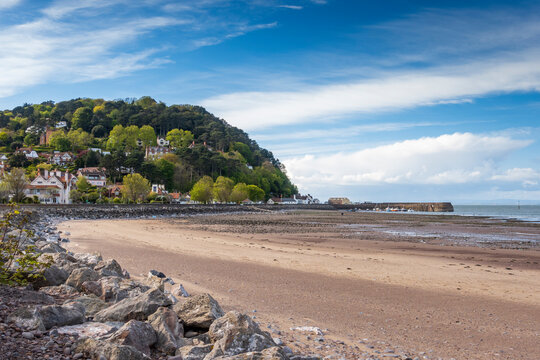 The seafront and beach at Minehead in Somerset, with the harbour in the distance.