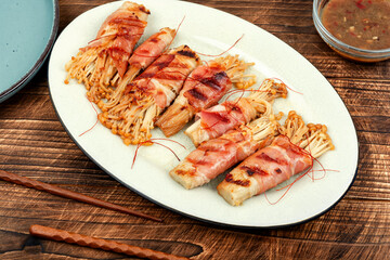 Enoki mushroom appetizer fried in bacon