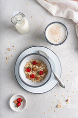 Breakfast with oatmeal and berries. Healthy food for breakfast. Table setting.