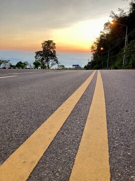 Yellow traffic line color Double solid lines to warn prohibiting overtaking, Yellow continuous tracks of prohibited overtaking painted on the asphalt, Safety driving and traffic regulating rules