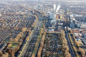 Aerial view Dutch residential area Rotterdam with freeway and railway
