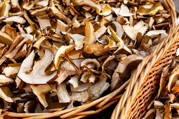 Dried, dehydrated porcini mushrooms in the basket. Vegetarian or vegan food.