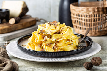 Truffle fettuccine with mushrooms. Italian long egg pasta made with hard cheese and butter....