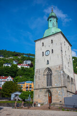 Bergen Cathedral in the City of Bergen, Norway is illumnated by a summer sunset