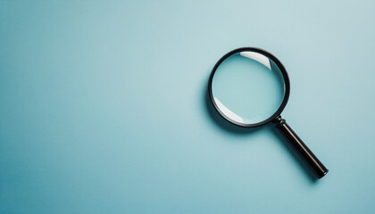 magnifying glass on blue
