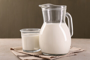 Glassware with tasty milk on light table