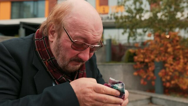 Elderly Man Exhibiting Severe Flu Symptoms and Distressed Cough. Senior Male Coping with Seasonal Flu Symptoms, Painful Flu Struggles Senior persone Sneezing and Coughing in Distress