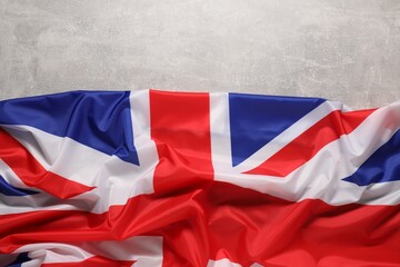 Flag of United Kingdom on light gray background, top view. Space for text - obrazy, fototapety, plakaty