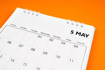 May 2024 month calendar on orange color cover background.