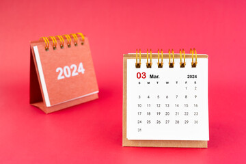 2024 March Mini Calendar On Red Background.