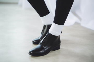 White women's socks mockup, black shoes, casual fashion, closeup view