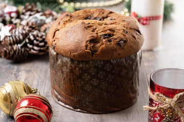 Christmas panettone cake with chocolate chips on wooden table