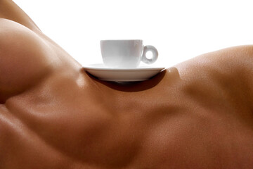 Body part portrait. White cup of coffee stands on naked female body with perfect body shapes, on...