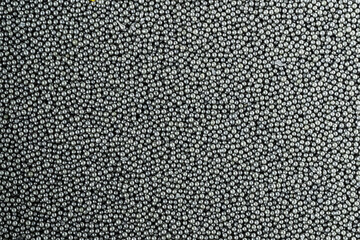 Photo background texture of gunpowder for loading cartridges on a magnum revolver.