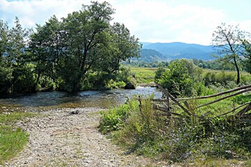 Rural road and ford across the river