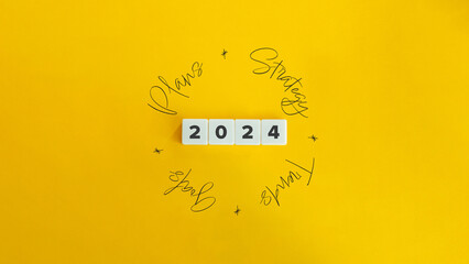 2024 Plans, Strategy, Goals, Trends. Concept Image. Letter Tiles and Cursive Text on Yellow...