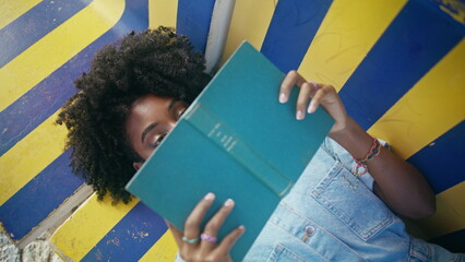 Student book lying bench learning college homework closeup. Girl hiding textbook