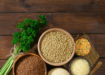 various types of cereals on a wooden table