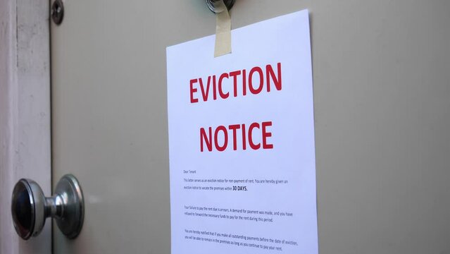 Eviction Notice Being Put onto door