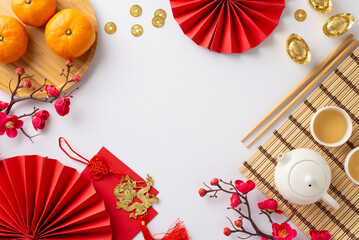Lunar New Year ambiance captured from top view: exquisite tea ceremony essentials, Feng Shui...
