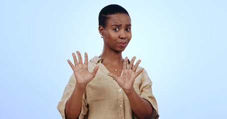 Black woman, portrait and hands for no, rejection or refusal isolated against a blue studio...